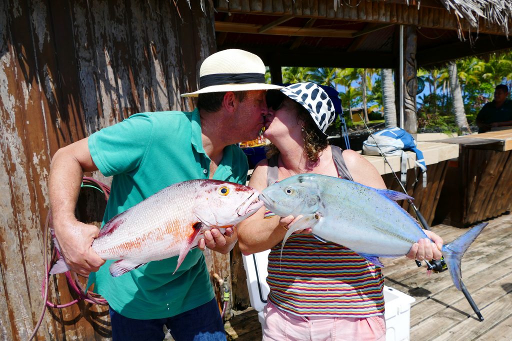 happy couple fishing at Le Vasa Resort